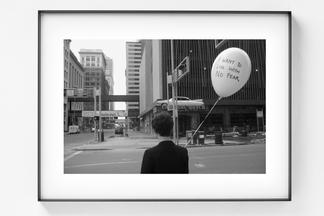 Framed black and white photo of a person, with the...