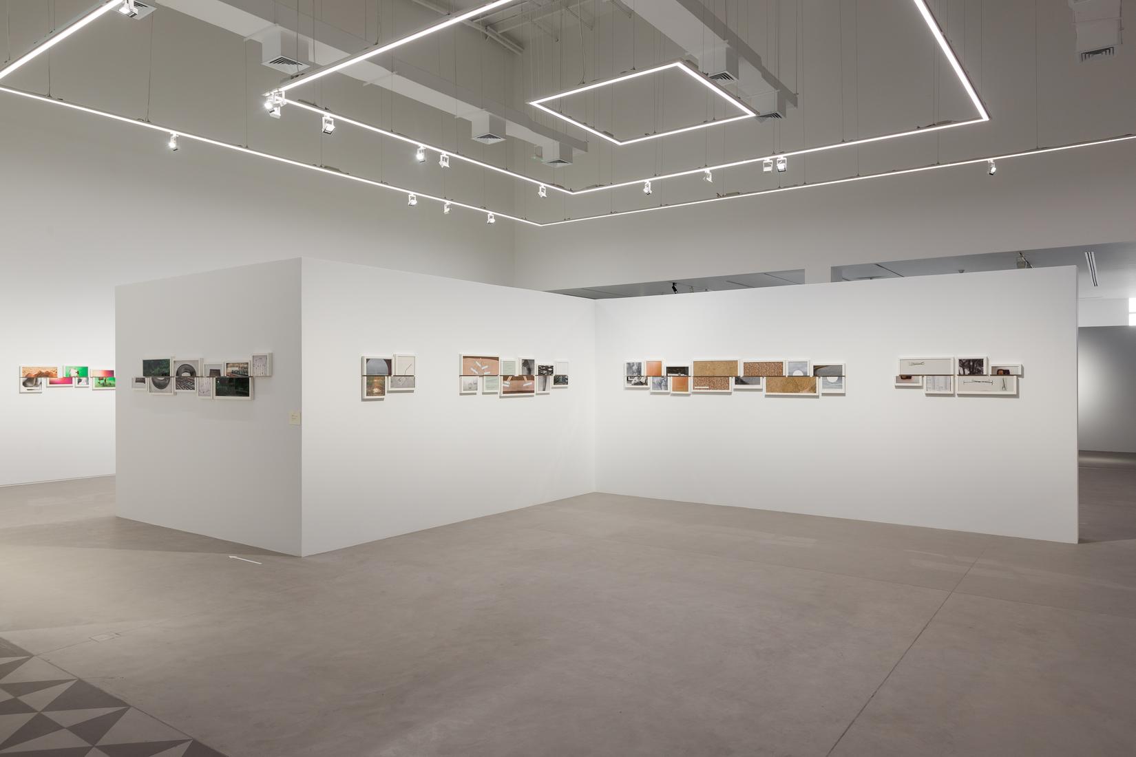 Installation photo of color and black and white ph...