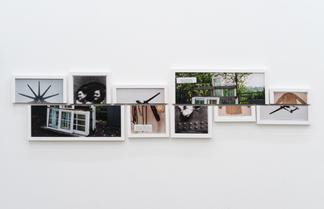 Color and black and white photos in white wood fra...