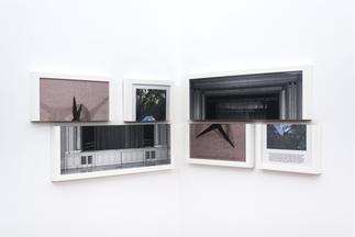 Color and black and white photos in white wood fra...